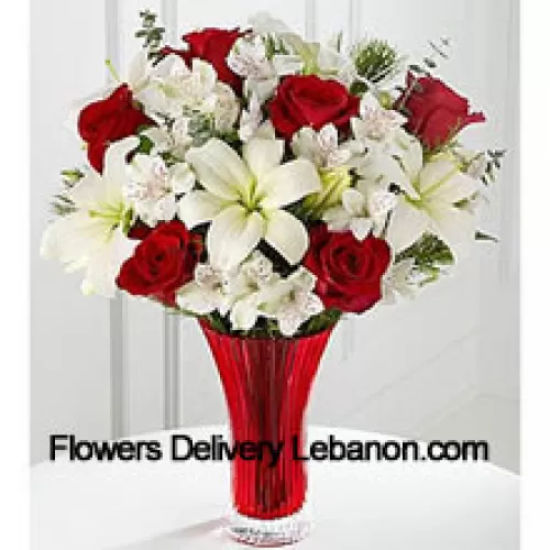 This Bouquet?is a gorgeous expression of yuletide joy and elegance. Red roses pop against a background of white Asiatic lilies and Peruvian lilies lovingly arranged in a red designer glass vase to create a bouquet of seasonal celebration. (Please Note That We Reserve The Right To Substitute Any Product With A Suitable Product Of Equal Value In Case Of Non-Availability Of A Certain Product)